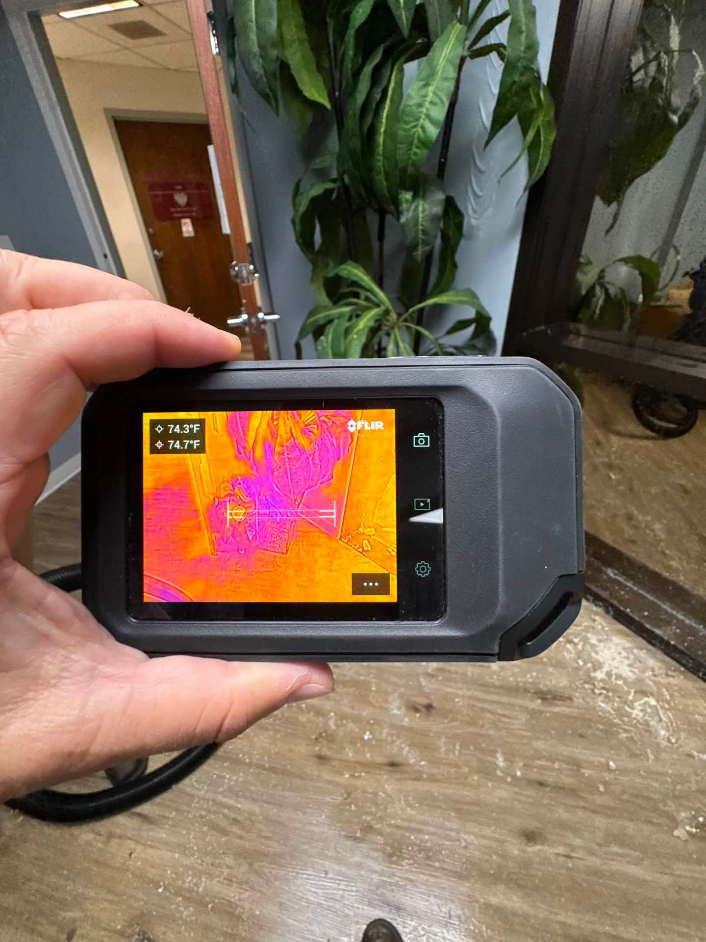 Thermal camera inspection near an office doorway