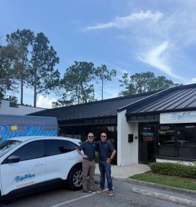 Big Wave Restoration owners outside their company office